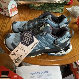 Size 9 Salomon  Ortholite sneakers new with tags